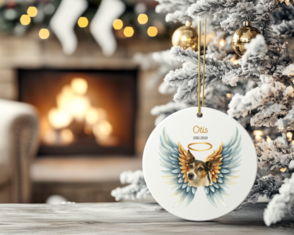Personalized dog angel ornament on a Christmas tree with a fireplace in the background